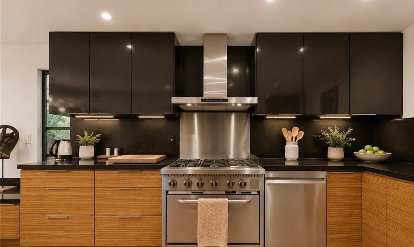 Kitchen range with dark cabinets and wood-grain drawers