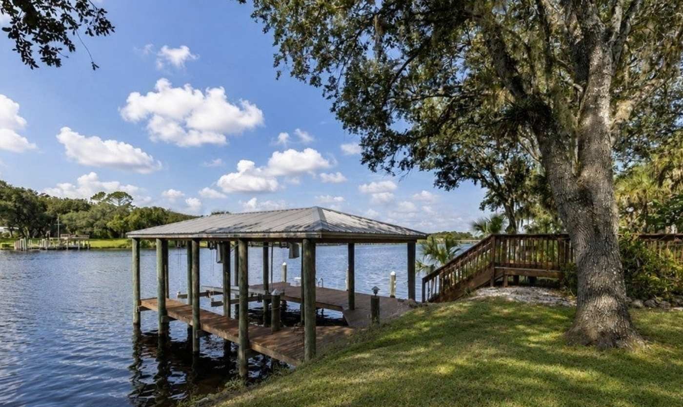 Covered boathouse and dock on the Caloosahatchee River
